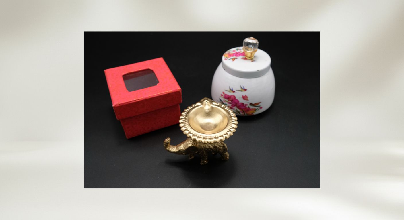 Complete Diwali favor gift set with decorative white floral jar elephant diya red gift box and organza bag