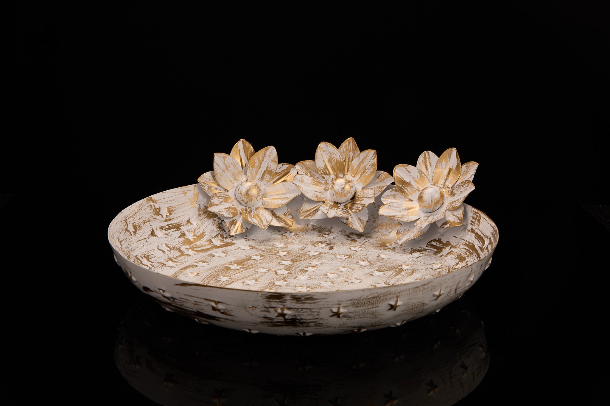 Vintage-style white urli with lotus flowers showing distressed finish and neutral aesthetic for modern Indian home decor