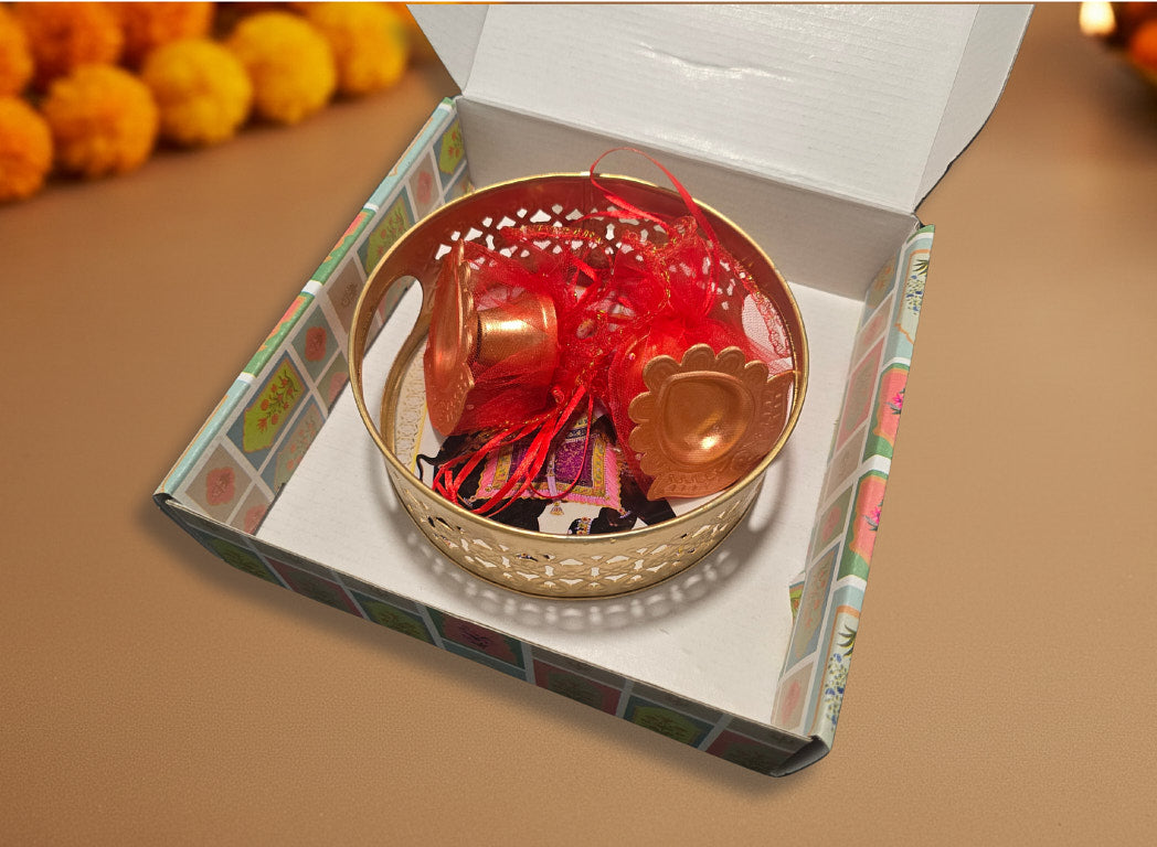 Diwali favor gift showing gold tray with red tissue paper in colorful floral pattern gift box alternative packaging option