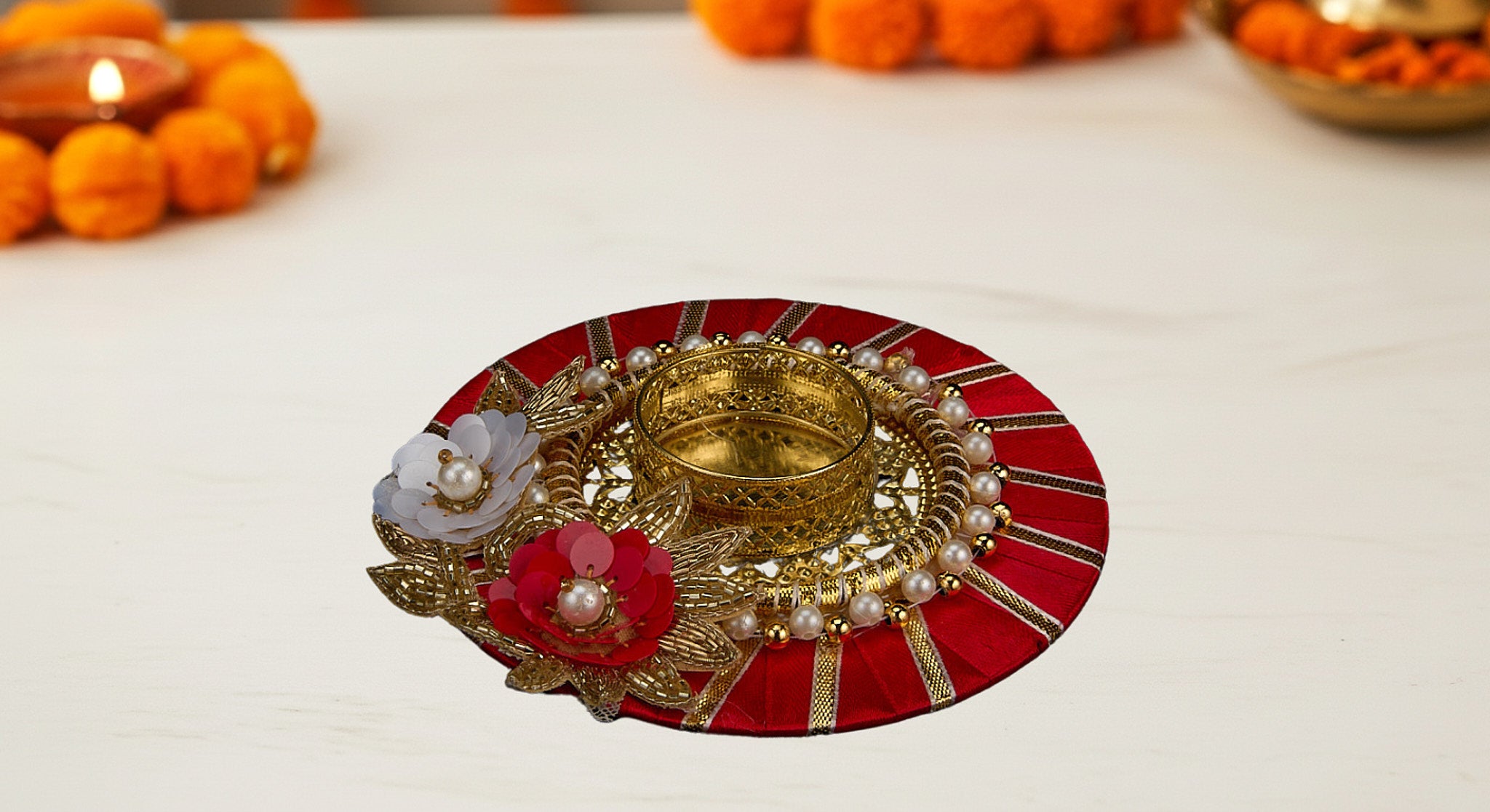 Three dual diya favor sets in vibrant organza bags showing blue pink and yellow colors with handcrafted fabric and metal diyas for Diwali favors