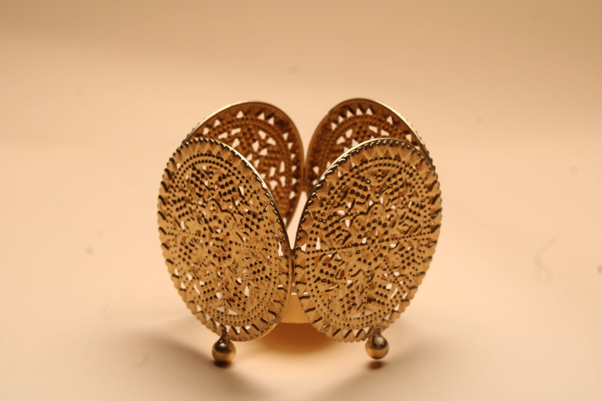 Three dual diya favor sets in vibrant organza bags showing blue pink and yellow colors with handcrafted fabric and metal diyas for Diwali favors