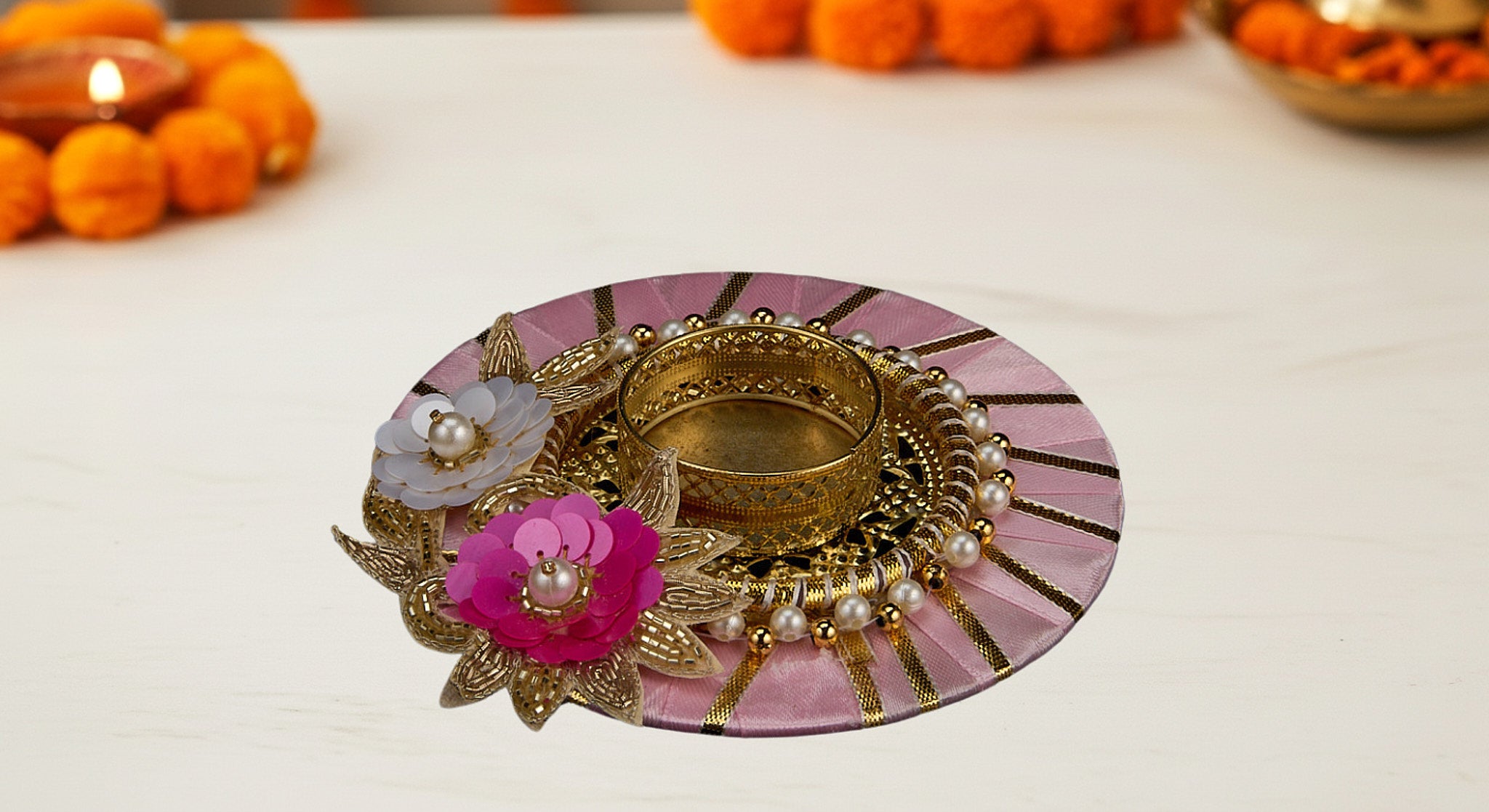 Three dual diya favor sets in vibrant organza bags showing blue pink and yellow colors with handcrafted fabric and metal diyas for Diwali favors