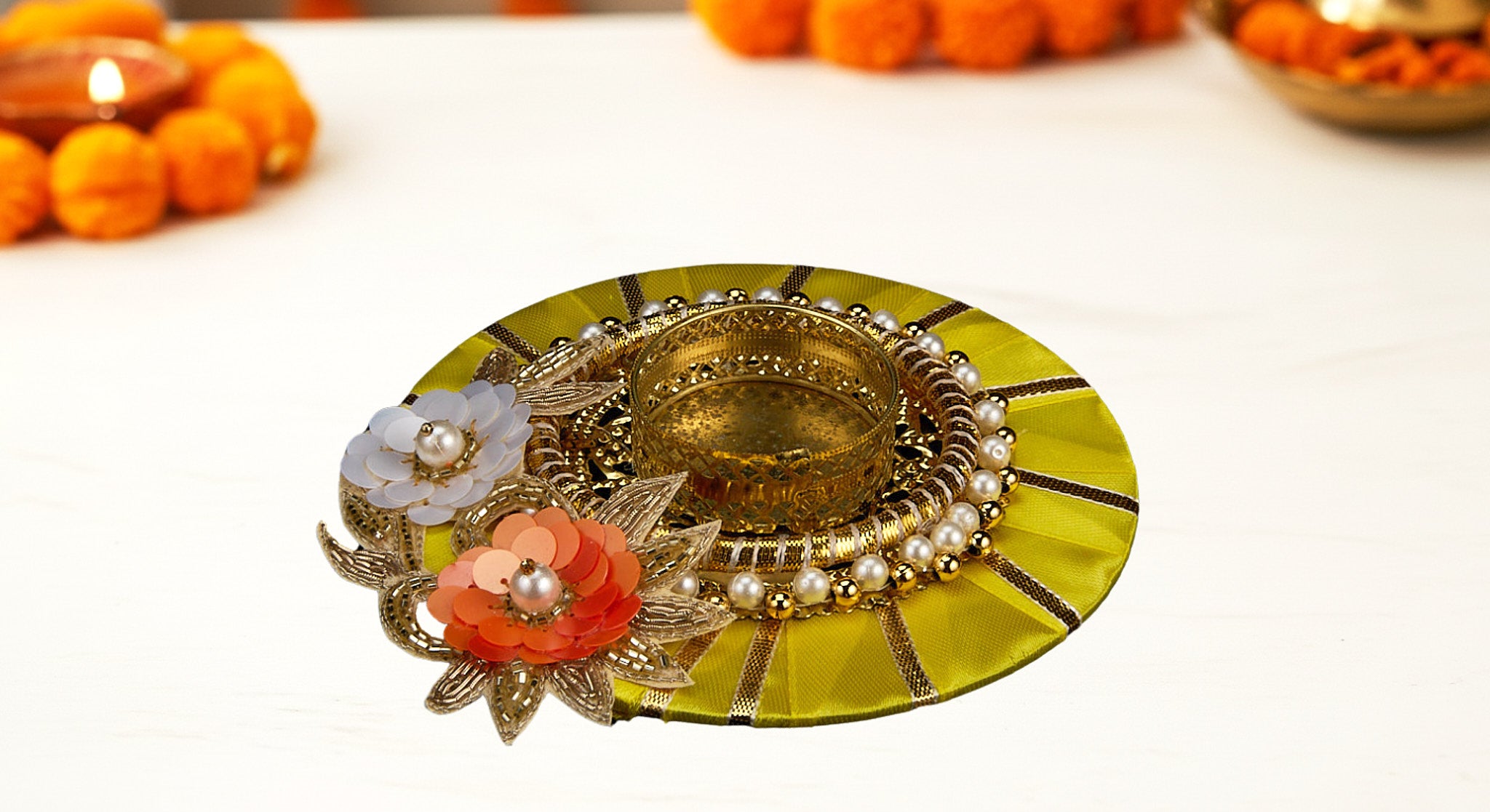 Three dual diya favor sets in vibrant organza bags showing blue pink and yellow colors with handcrafted fabric and metal diyas for Diwali favors