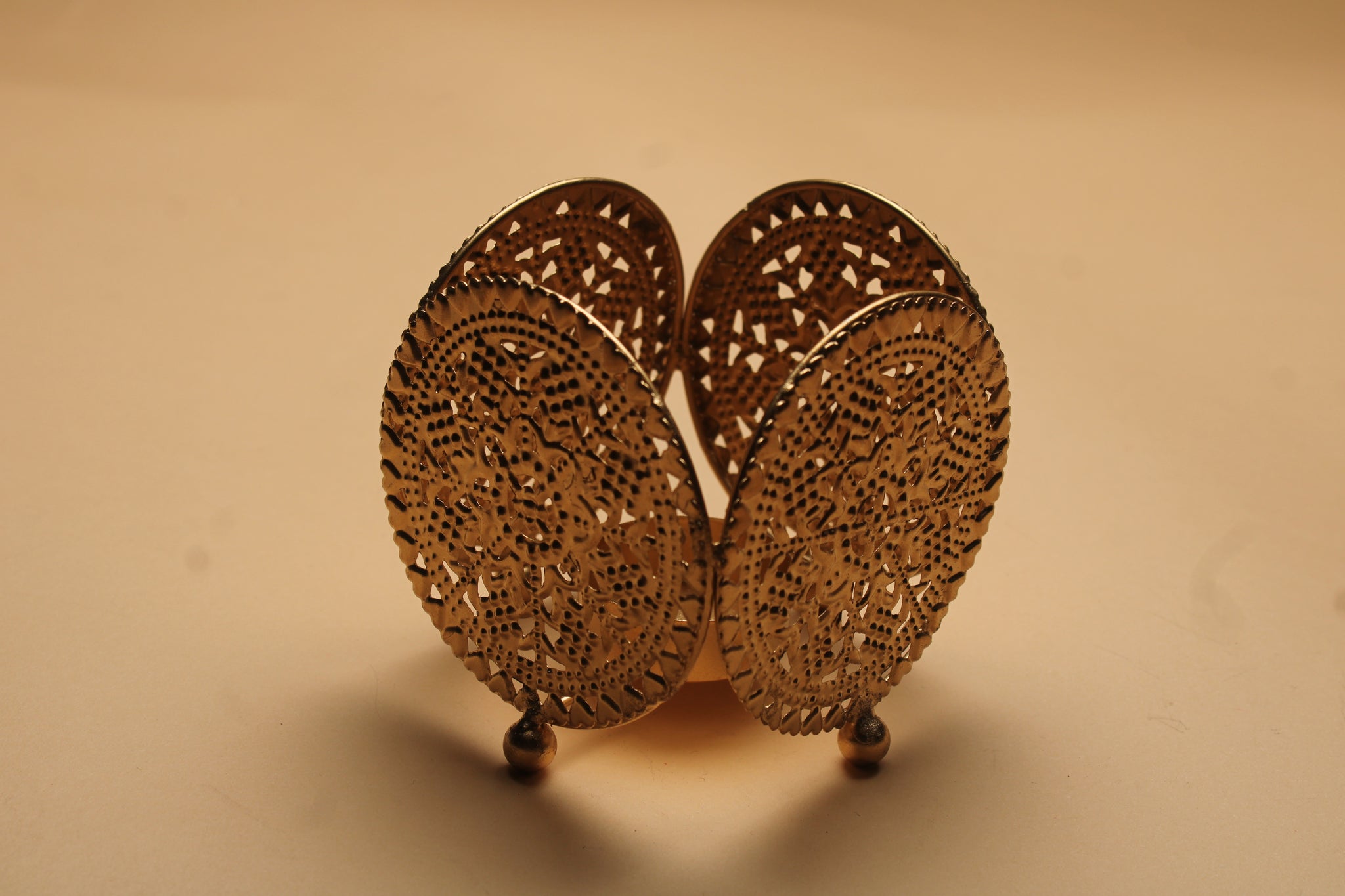 Three dual diya favor sets in vibrant organza bags showing blue pink and yellow colors with handcrafted fabric and metal diyas for Diwali favors