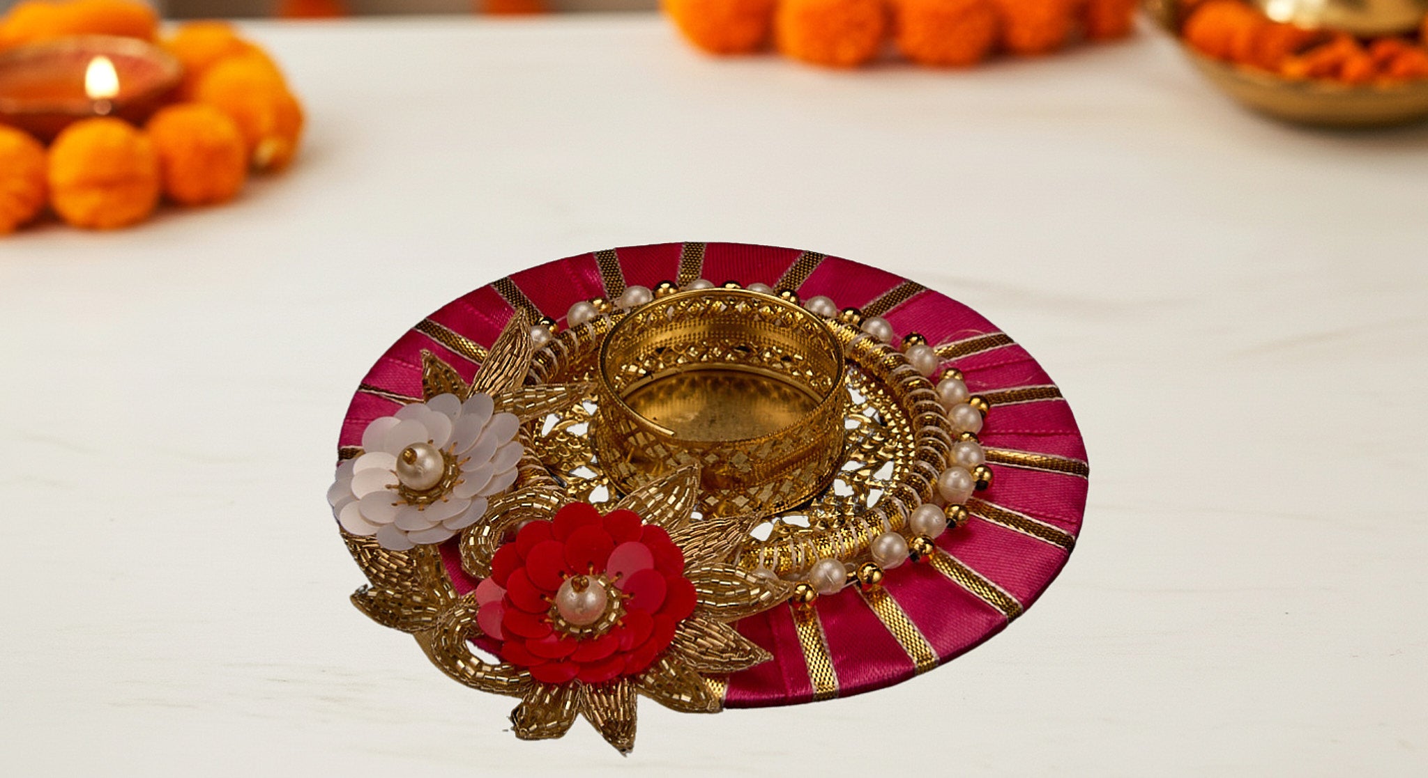 Three dual diya favor sets in vibrant organza bags showing blue pink and yellow colors with handcrafted fabric and metal diyas for Diwali favors