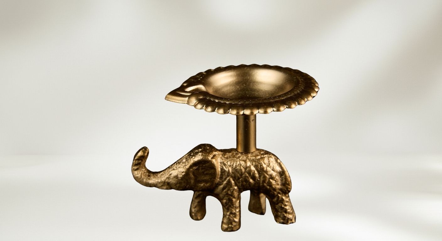 Gold finish elephant diya holder for Diwali favor gift showing decorative bowl on elephant figurine base