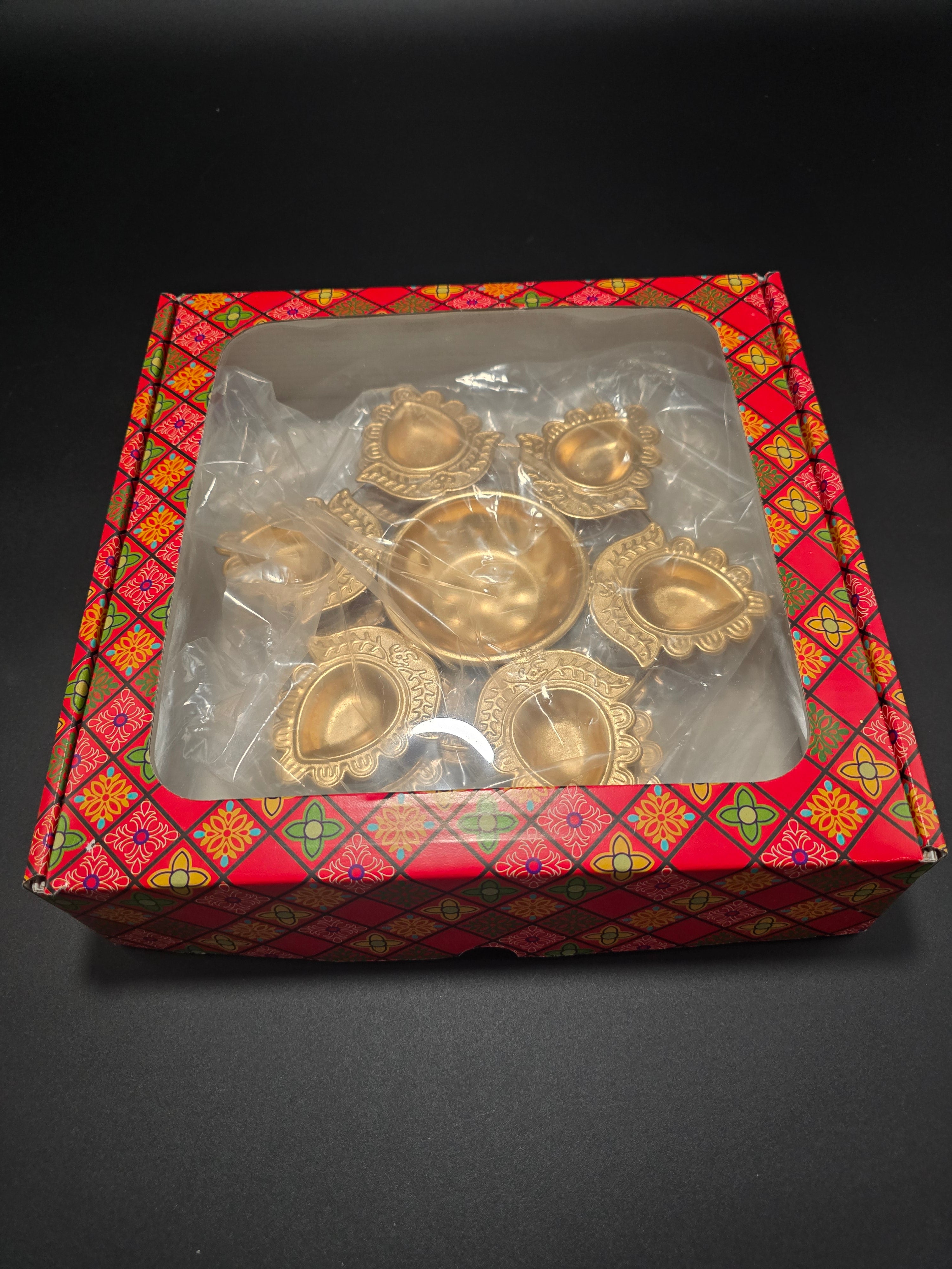 Two traditional rangoli urli diya plates with mandala design in decorative gift box for authentic Diwali oil lamp ceremonies