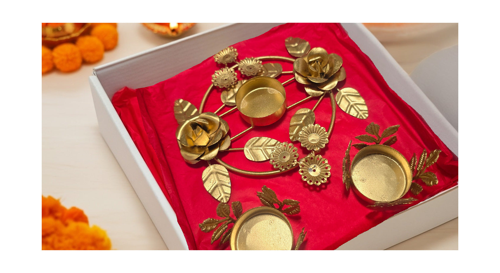 Diwali floral diya gift set showing three pieces with botanical rose design in decorative gift box with red lining