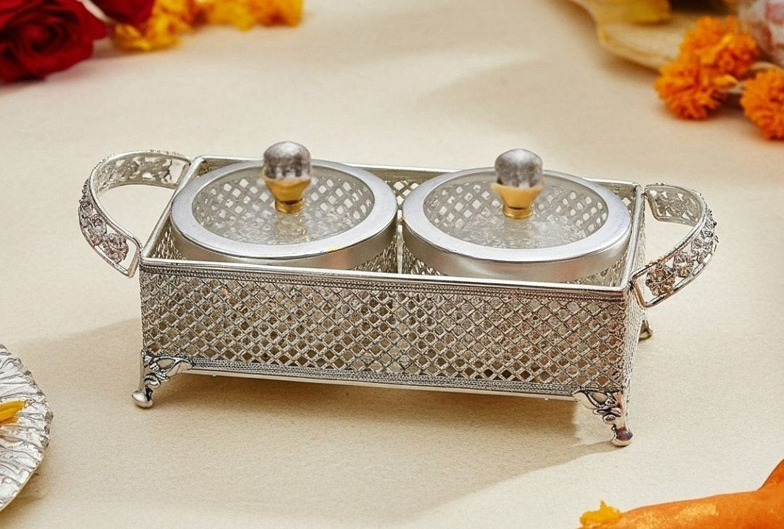 Diwali serving set with two covered silver bowls with decorative lids on lattice cutwork tray for dry fruits and nuts