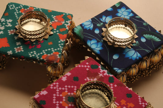Assorted handcrafted fabric diyas with gota work showing three different traditional Indian pattern variations for Diwali favors