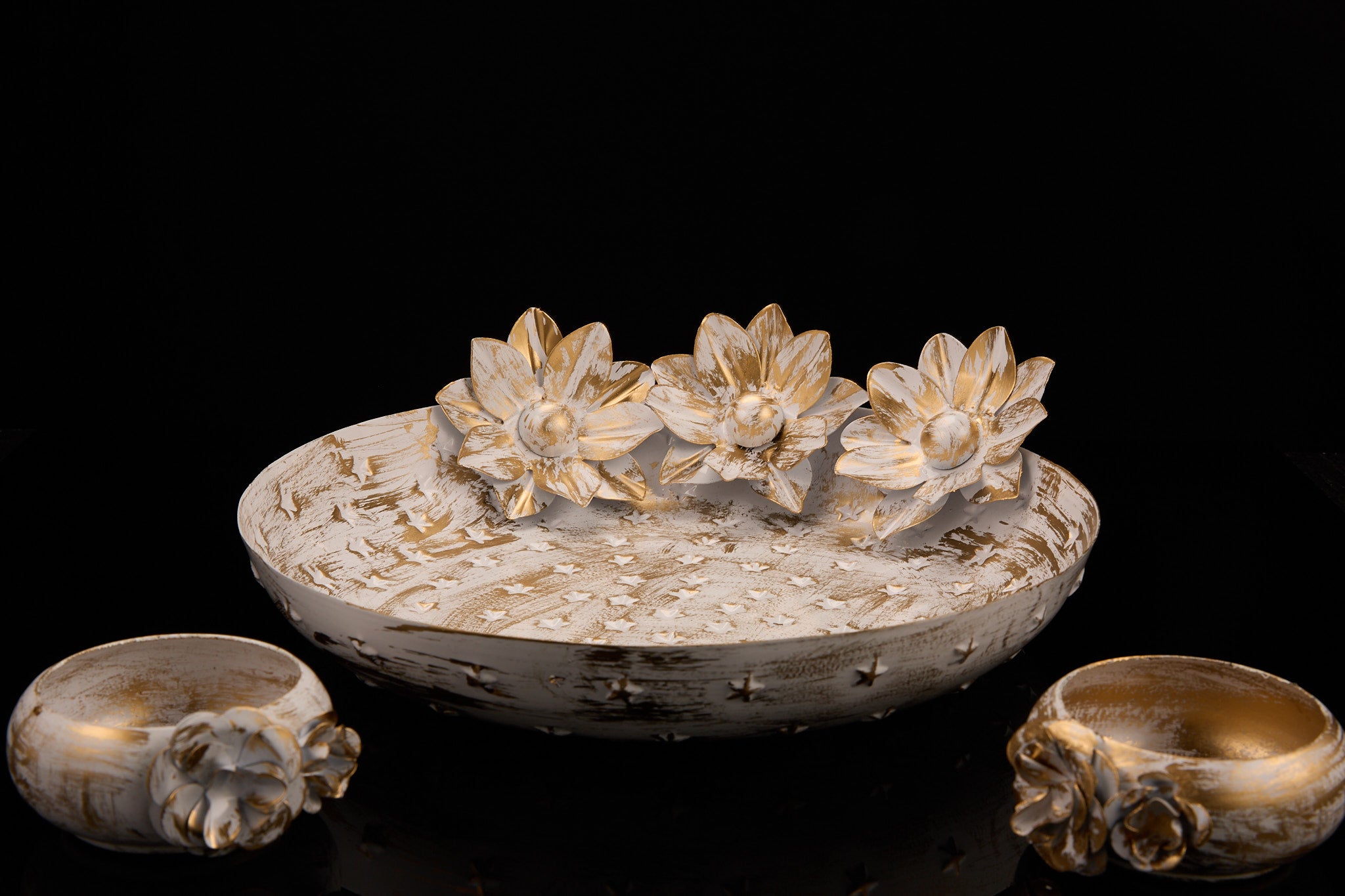 Complete distressed white urli set showing centerpiece with lotus flowers and two tea light bowls in vintage white finish