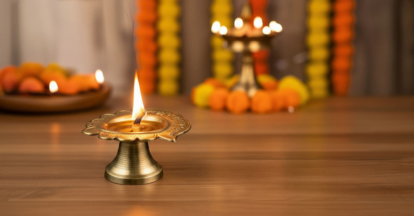 Urli and diya set showing single gold urli with two metal diyas in white corrugated box for budget-friendly Diwali centerpiece