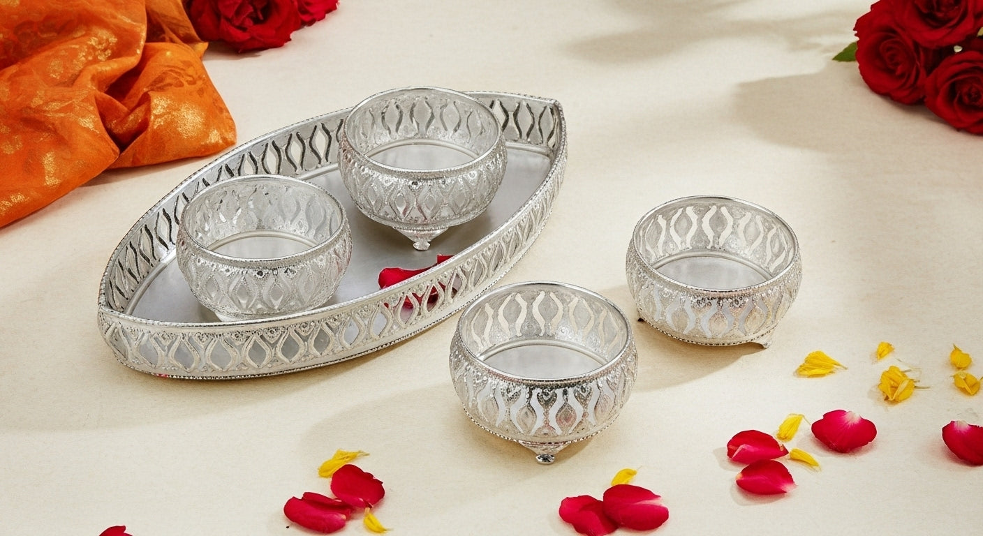 Premium Diwali gift hamper featuring silver metal serving tray with bowls filled with dried fruits and nuts for festive entertaining