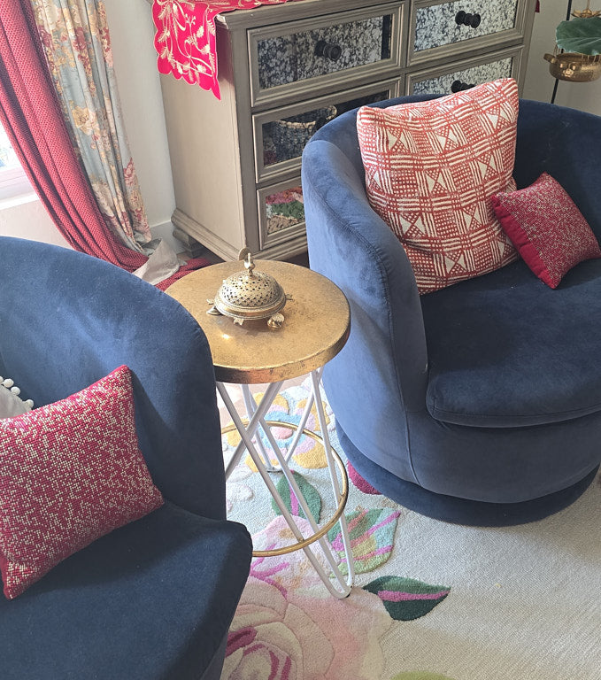 A close-up, detailed shot of the top of the brass bakhoor burner, focusing on the craftsmanship of the peacock and the delicate perforations on the lid.