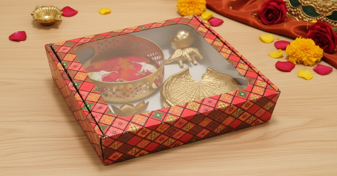 Diwali gift set with elephant diyas basket and coasters displayed in premium red decorative gift box ready to give